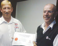 Kobus Reinecke (branch chairman left) handing the presenter certificate to Fred Venter.